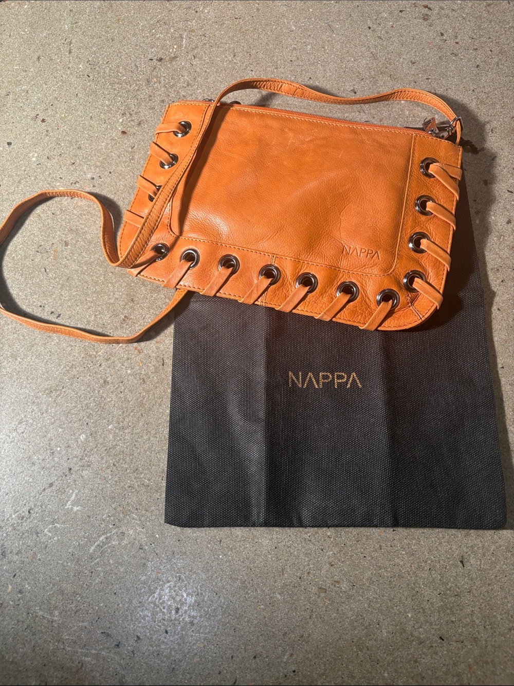 Orange Leather Shoulder Bag with Grommet Detail